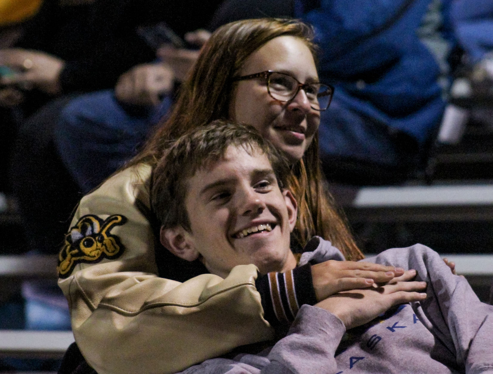 Sophomore Grace Siegel holds junior Logan Vandenbosch during halftime on Friday